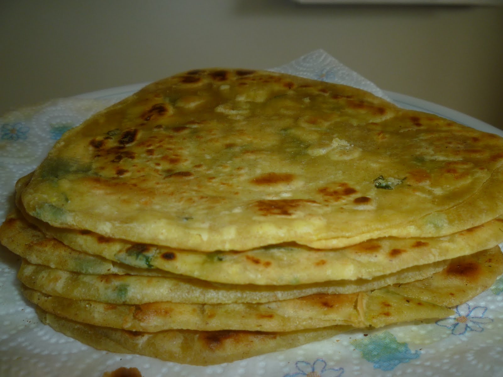 Garlic Coriander Triangle Parathas or fried Indian bread 
